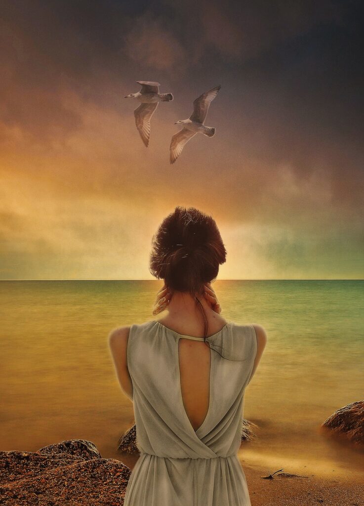 woman, sea, rocks-6964282.jpg